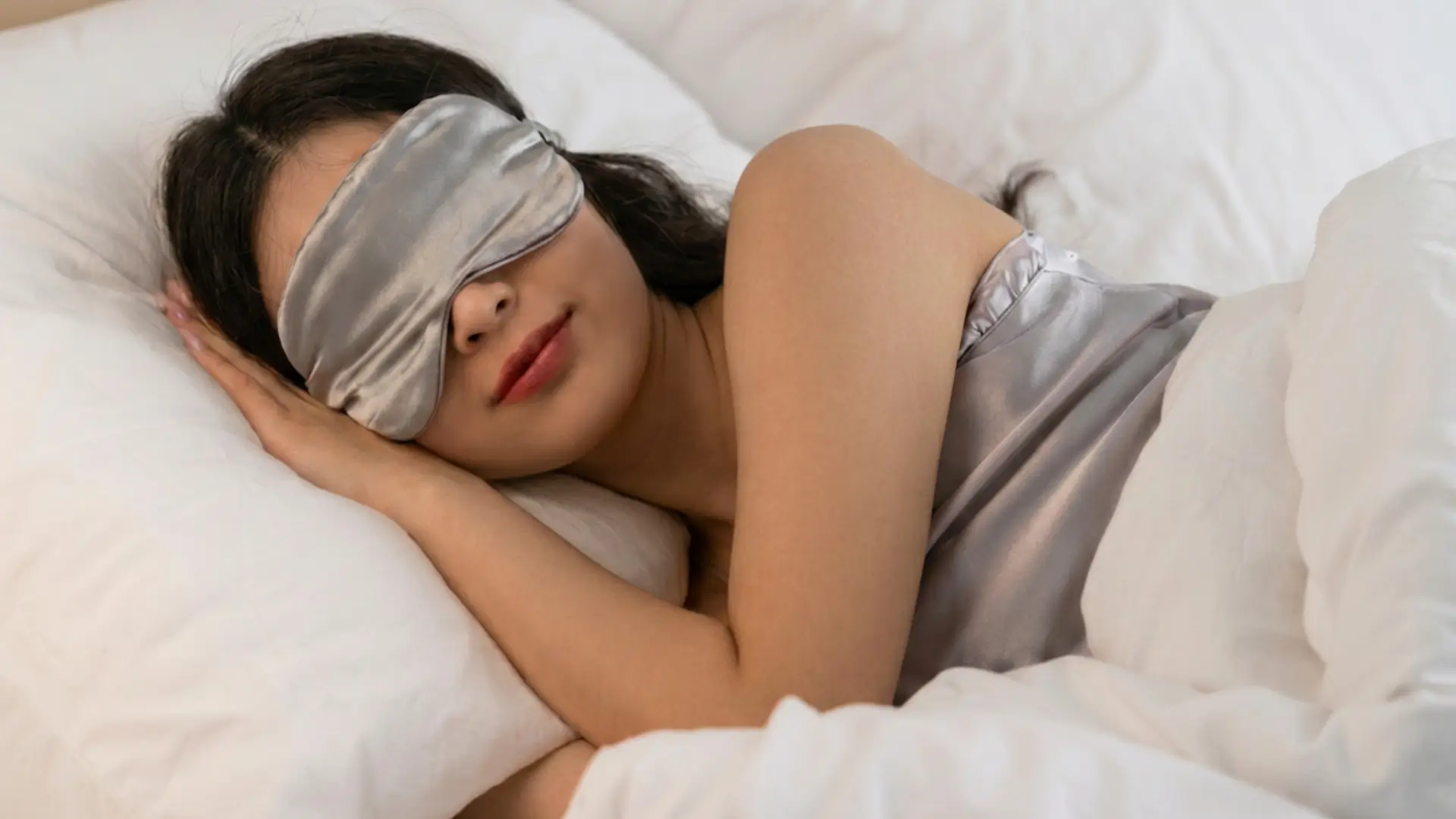 Woman resting with a sleep mask on